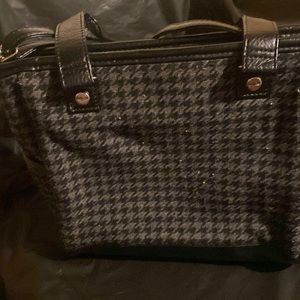 31 purse made of fabric and leather, approximately 9 inches wide by 8 1/2 inches